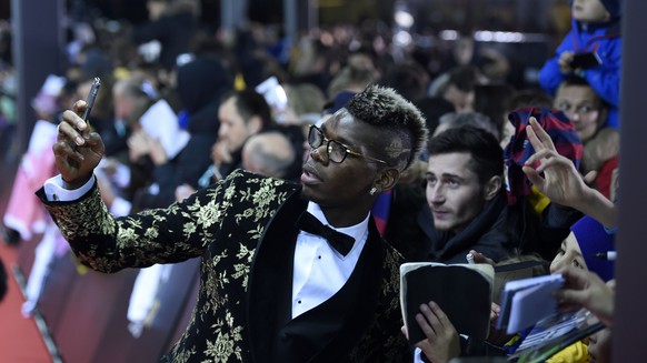 France&#039;s Paul Pogba arrives on the red carpet prior to the FIFA Ballon d&#039;Or awarding ceremony at the Kongresshaus in Zurich, Switzerland, Monday, January 11, 2016. in Zurich, Switzerland, Mo ...
