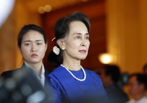 epa09224676 (FILE) - Myanmar State Counselor Aung San Suu Kyi (R) waits for the arrival of Chinese President Xi at the presidential house in Naypyitaw, Myanmar, 17 January 2020 (reissued 24 May 2021). ...