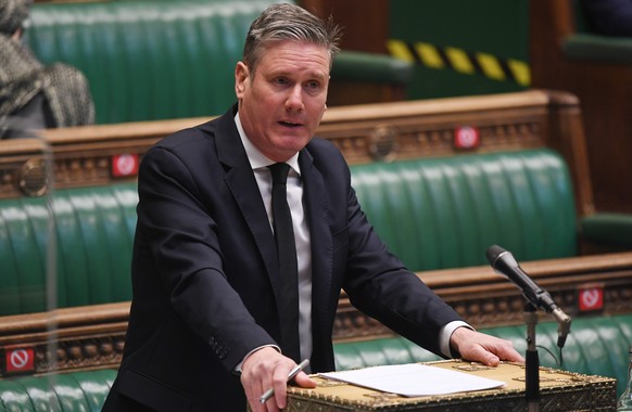 epa09135178 A handout photo made available by the UK Parliament shows Labour leader Keir Starmer during Prime Ministers Questions in the House of Commons in London, Britain, 14 April 2021. EPA/JESSICA ...