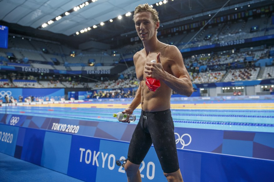 epa09362381 Jeremy Desplanches of Switzerland walks out after competing in the men&#039;s 100m Breaststroke Heats during the Swimming events of the Tokyo 2020 Olympic Games at the Tokyo Aquatics Centr ...