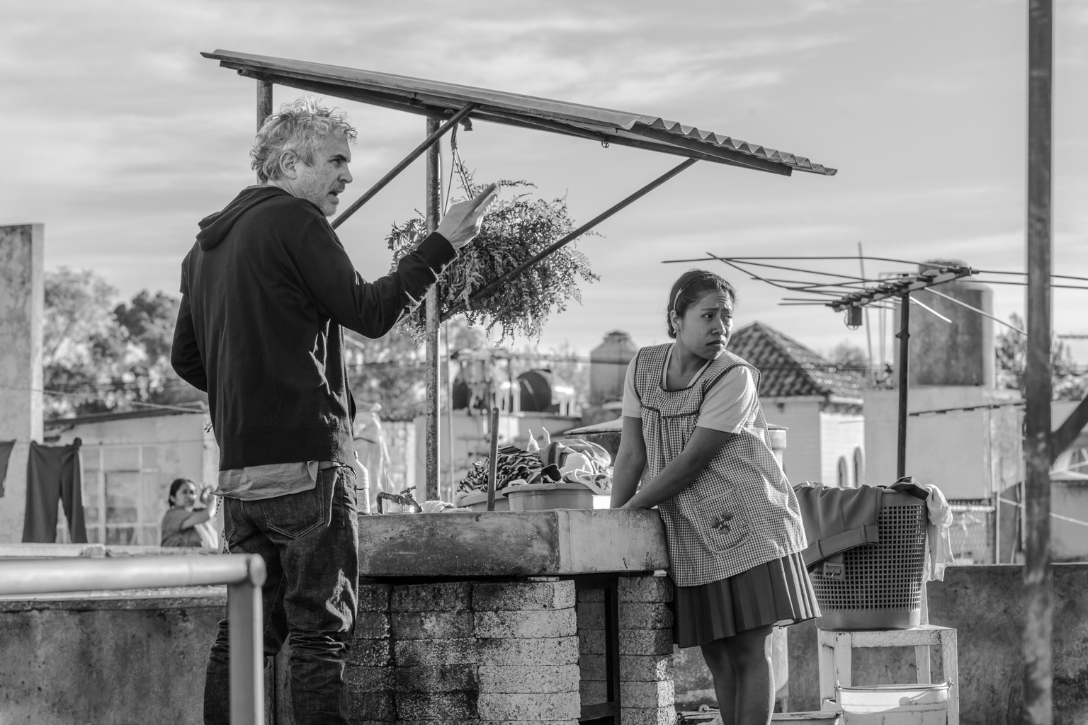 This image released by Netflix shows filmmaker Alfonso Cuaron, left, and actress Yalitza Aparicio on the set of &quot;Roma.&quot; Cuaron’s “Roma” has dominated the New York Film Critics Circle Awards, ...