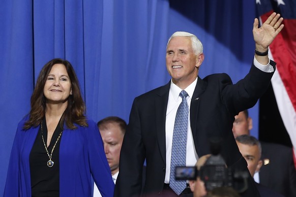 FILE - In this Oct. 10, 2019 file photo, Vice President Mike Pence and his wife Karen arrive prior to a campaign rally speech by appear in Minneapolis. Vice President Pence is bringing President Donal ...