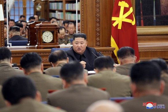 epa08086247 An undated photo released by the official North Korean Central News Agency (KCNA) on 22 December 2019 shows North Korean leader Kim Jong-un (C) chairing the Third Enlarged Meeting of the S ...