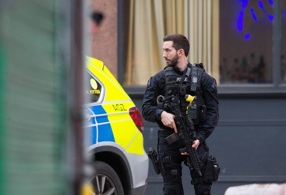 epa08188208 An armed policeman secures the site of an incident after a man has been shot by armed police at a street in Streatham, London, Britain, 02 February 2020. According to reports, a man has be ...