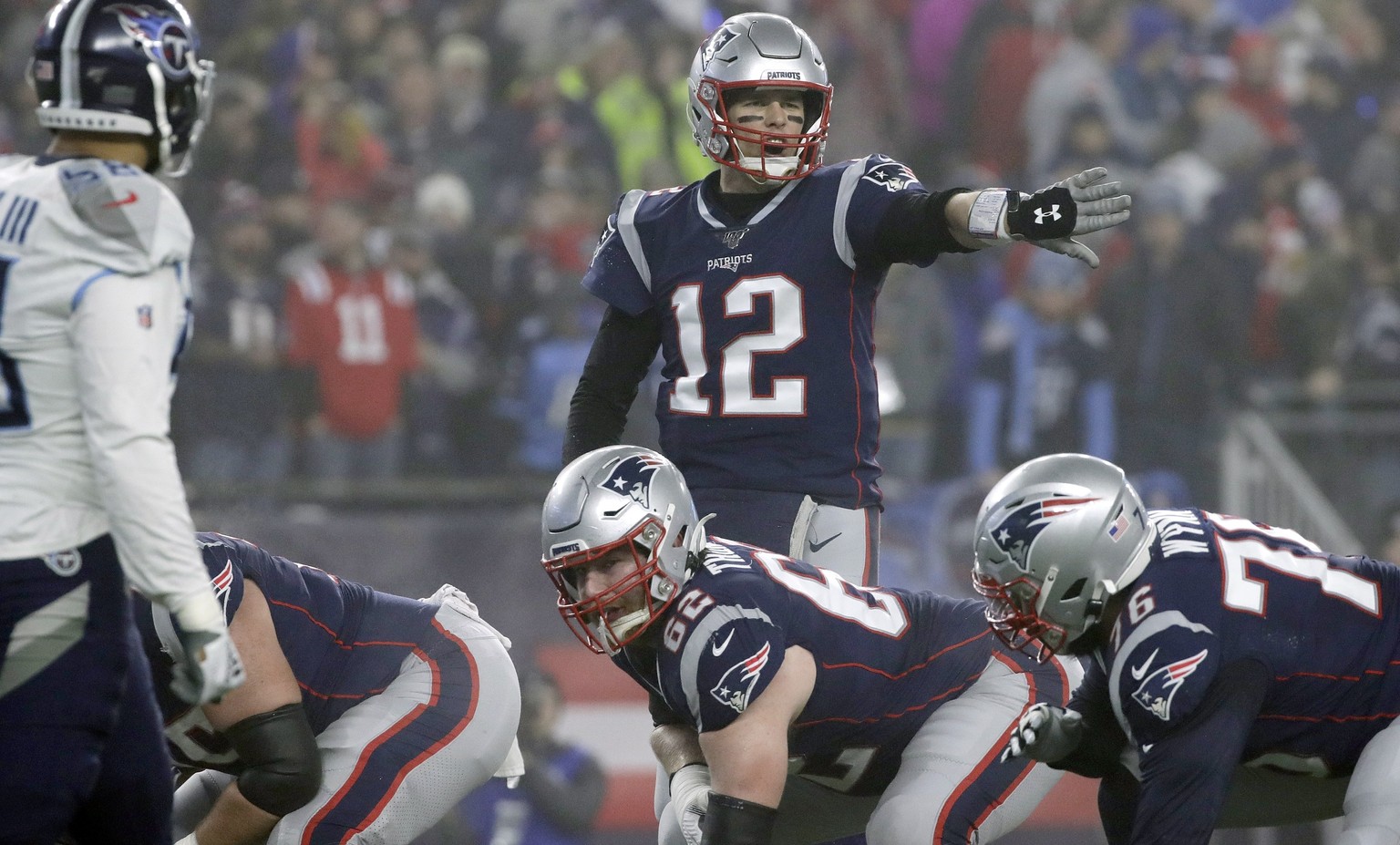 New England Patriots quarterback Tom Brady calls signals at the line of scrimmage in the first half of an NFL wild-card playoff football game against the Tennessee Titans, Saturday, Jan. 4, 2020, in F ...