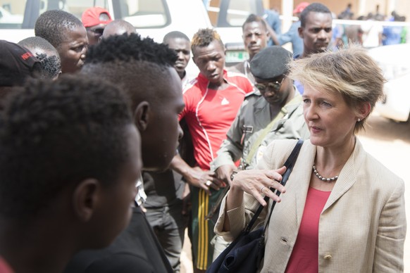 epa06247567 Swiss Federal Councillor and head of the Department of Justice and Police, Simonetta Sommaruga (R) speaks with a migrant during the visit of a migrant reception center of the International ...