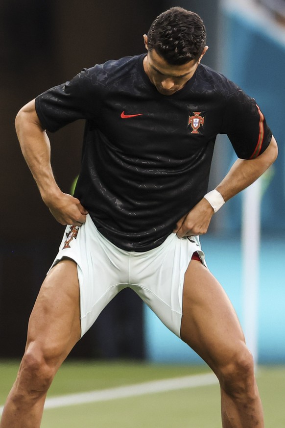Portugal&#039;s Cristiano Ronaldo warms up prior the Euro 2020 soccer championship group F match between Hungary and Portugal at the Ferenc Puskas stadium in Budapest, Hungary, Tuesday, June 15, 2021. ...