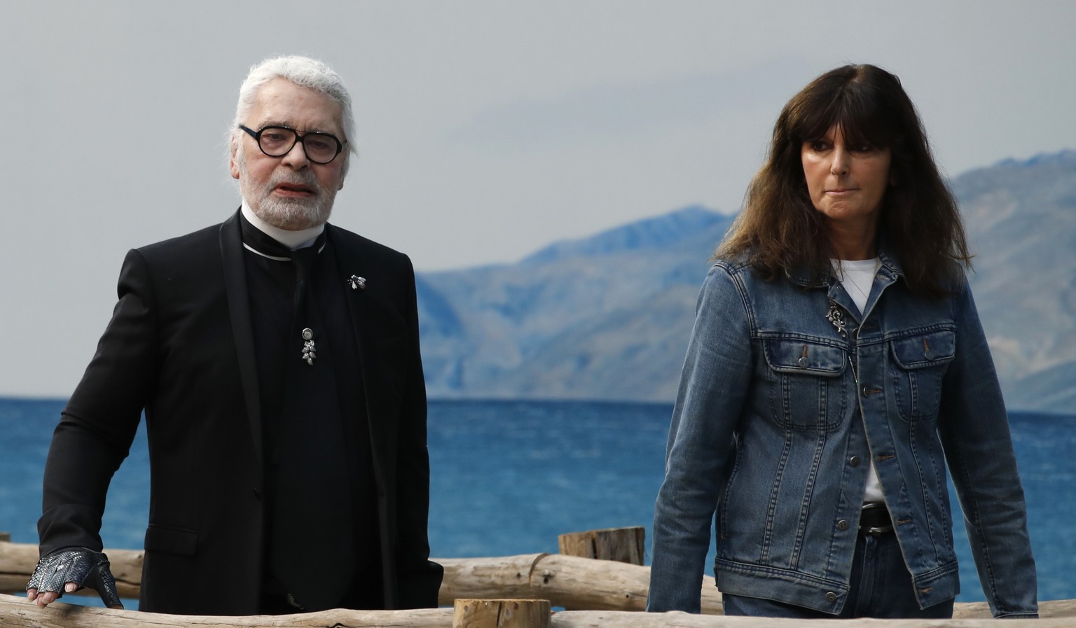 FILE - In this Oct.2, 2018 file photo, French fashion studio director Virginie Viard and German fashion designer Karl Lagerfeld pose after the presentation of Chanel Spring/Summer 2019 ready-to-wear f ...