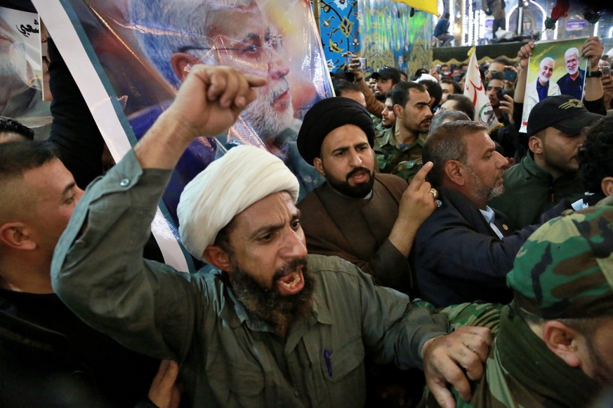 Mourners chant slogans against the U.S. during the funeral of Iran&#039;s top general Qassem Soleimani, and Abu Mahdi al-Muhandis, deputy commander of Iran-backed militias in Iraq known as the Popular ...