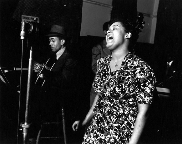 Jazz singer Billie Holiday sings &quot;Strange Fruit&quot; during a recording session in this April 20, 1939 photo. The song composed by Abel Meeropol, which is about Southern lynchings of blacks, is  ...