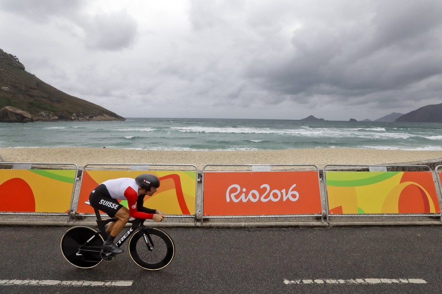 Cyclist Fabian Cancellara of Switzerland rides along Pontal beach during the men&#039;s individual time trial event at the 2016 Summer Olympics in Pontal beach, Rio de Janeiro, Brazil, Wednesday, Aug. ...