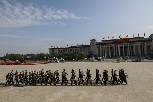 epa08707399 Members of military band leave after the flower-basket-laying ceremony for the monument to the people&#039;s heroes ahead of Chinese National Day at the Monument to the People&#039;s Heroe ...