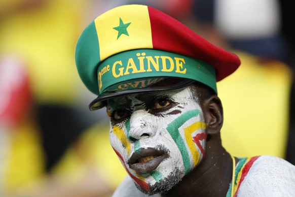 A supporter of Senegal reacts after the group H match between Senegal and Colombia, at the 2018 soccer World Cup in the Samara Arena in Samara, Russia, Thursday, June 28, 2018. Colombia won 1-0 and ad ...