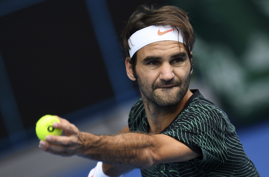 epa05706475 Roger Federer of Switzerland in action during a practice session ahead of the Australian Open tennis tournament on Rod Laver Arena in Melbourne, Victoria, Australia, 09 January 2017. The A ...