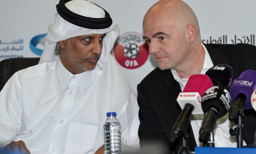 epa05271667 FIFA President Gianni Infantino (R) and HE Sheikh Hamad bin Khalifa bin Ahmed Al Thani (L) President of Qatar Football Association attend the joint press conference for FIFA, Supreme Commi ...