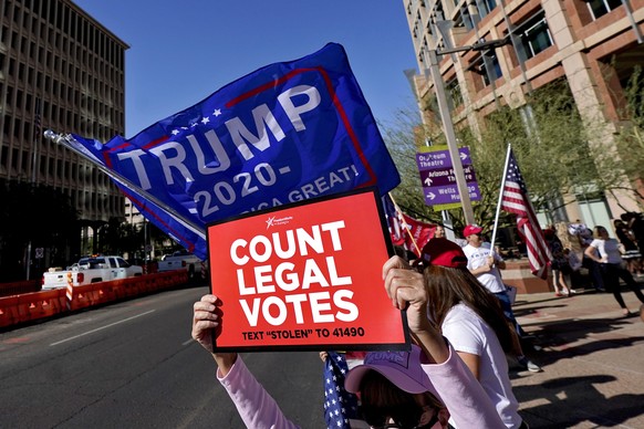 People rally outside City Hall, Thursday, Nov. 5, 2020, in Phoenix. Dozens of pro-Trump protesters gathered to protest after Democratic challenger Joe Biden was reported to have flipped the Republican ...