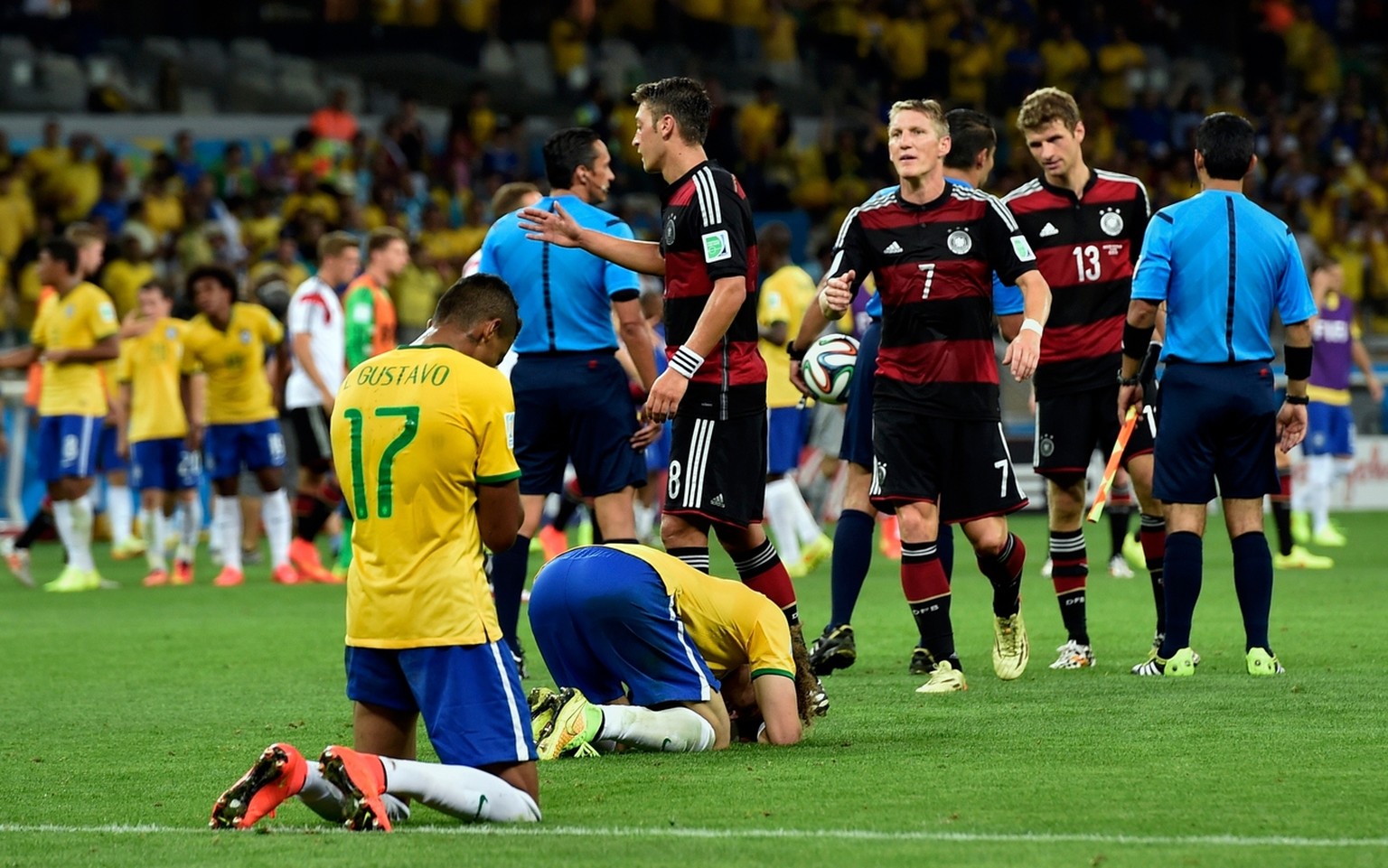 FILE - In this Tuesday, July 8, 2014 file photo, Brazil players sink to their knees after the team lost 7-1 against Germany in the World Cup semifinal soccer match in Belo Horizonte, Brazil. The 21st  ...