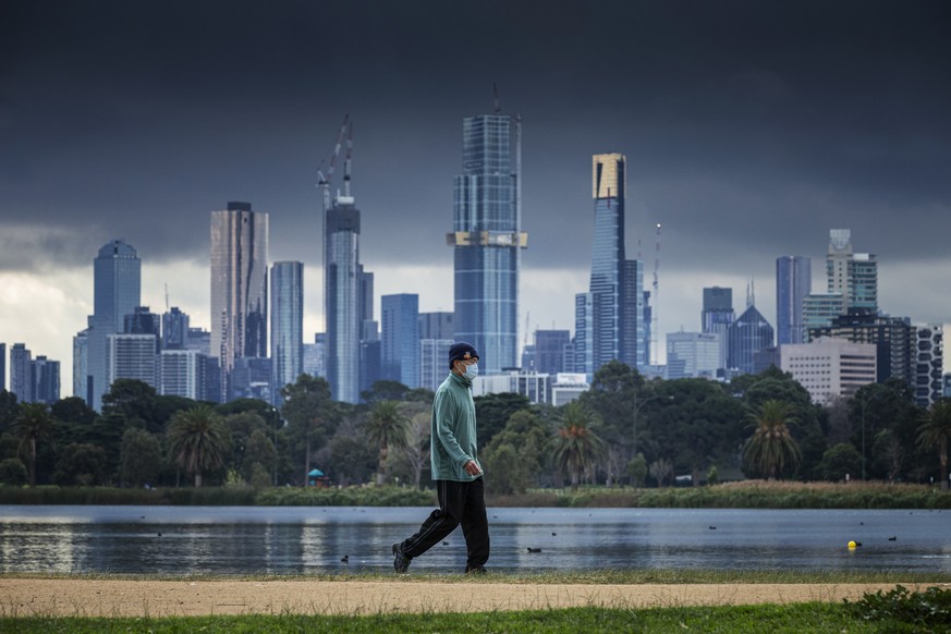 epa08541414 A general view at the Albert Park Lake in Melbourne, Victoria, Australia, 12 July 2020. Residents in metropolitan Melbourne have been advised to wear masks in public amid a spike in corona ...