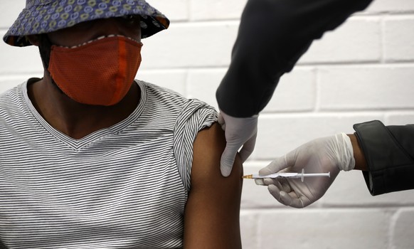 epa08505895 One of the first South African vaccine trialists gets injected during the clinical trial for a potential vaccine against the Covid-19 Corona virus at the Baragwanath hospital in Soweto, So ...