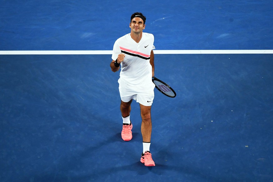 epa06450002 Roger Federer of Switzerland celebrates after winning his second round match against Jan-Lennard Struff of Germany at the Australian Open Grand Slam tennis tournament in Melbourne, Austral ...