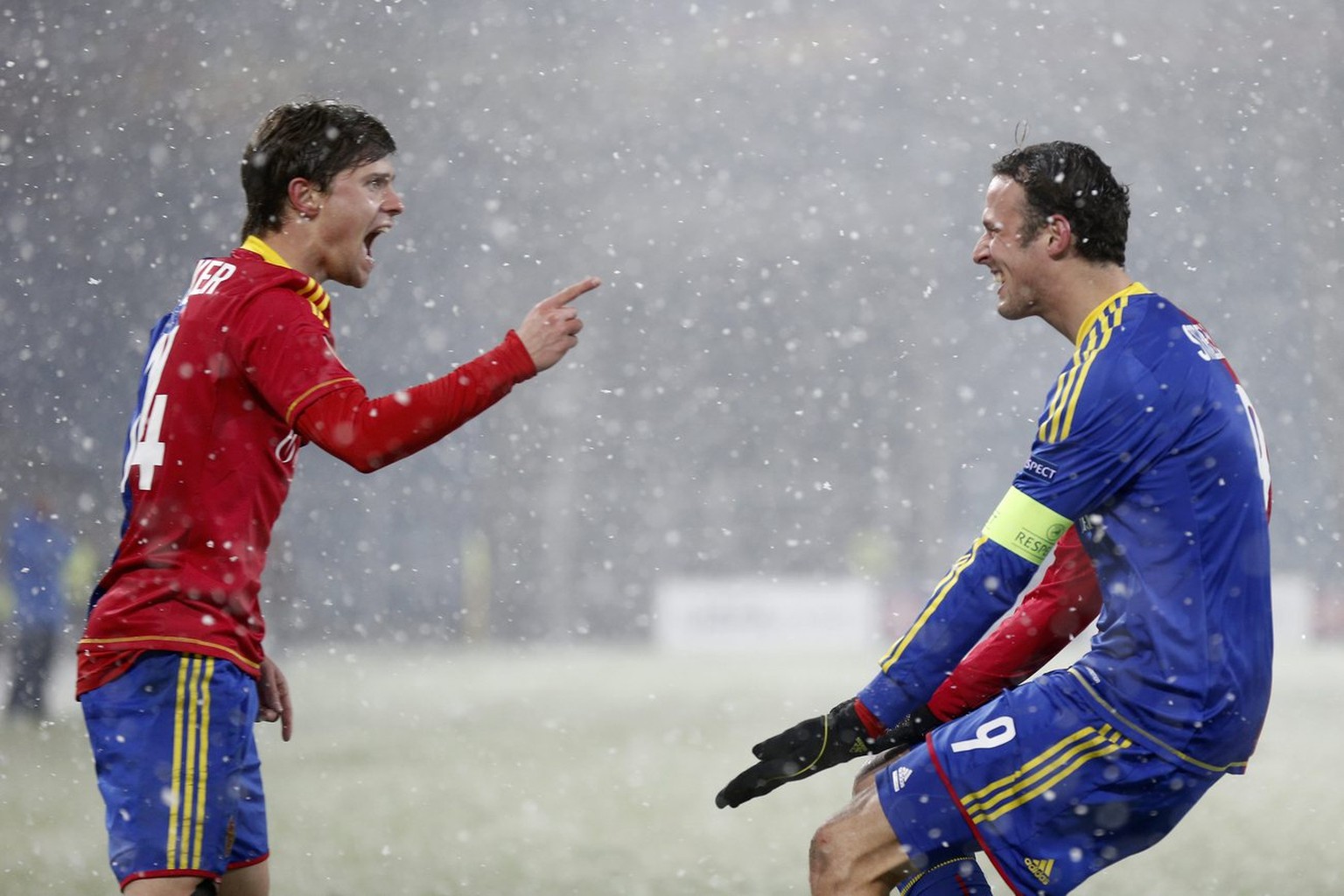 Basel&#039;s Marco Streller, right, celebrates with teammate Valentin Stocker after scoring the 2-0 during the UEFA Europa League round of 32 first leg soccer match between Switzerland&#039;s FC Basel ...
