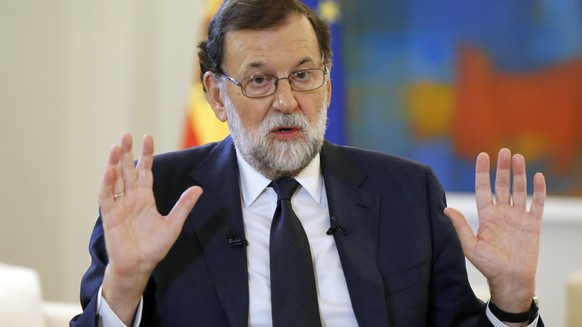 epa06246590 Spanish Prime Minister Mariano Rajoy gestures during an interview with Spanish News Agency Agencia EFE, at La Moncloa Palace in Madrid, Spain, 05 October 2017. Rajoy demanded from Cataloni ...
