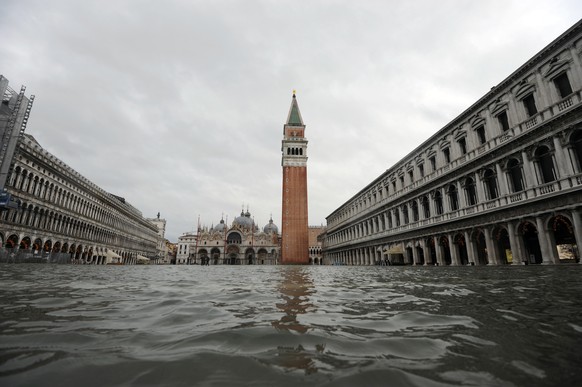 A flooded St. Mark&#039;s Square in Venice, Italy, Tuesday, Dec. 8, 2020. High tides flooded St. Mark���s Square in Venice on Sunday, propelled by winds that were stronger than predicted, so the new s ...