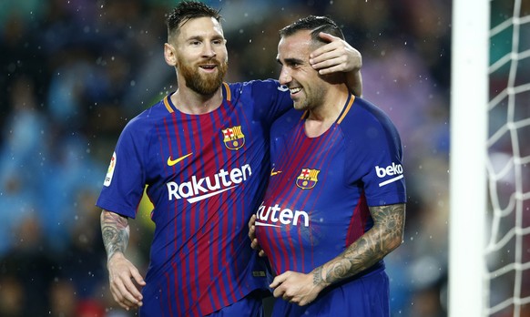 FC Barcelona&#039;s Paco Alcacer, right, celebrates after scoring with his teammate Lionel Messi during the Spanish La Liga soccer match between FC Barcelona and Sevilla at the Camp Nou stadium in Bar ...