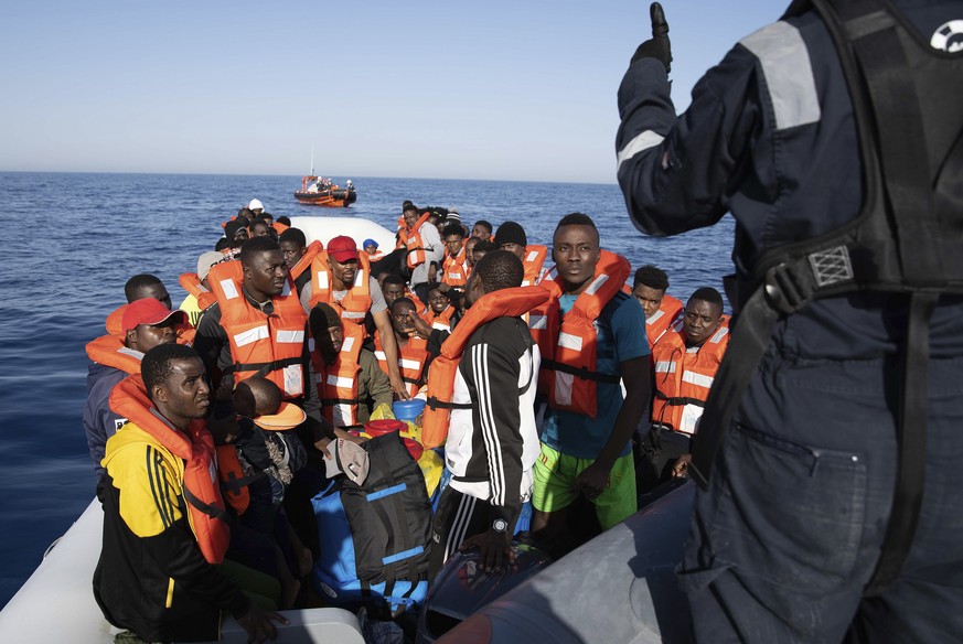 epa08495268 An undated handout photo made available by Sea-Watch.org shows more than 90 migrants on a toy boat as they are rescued by Sea Watch, 30km away off the Libyan Coast (issued 19 June 2020). G ...