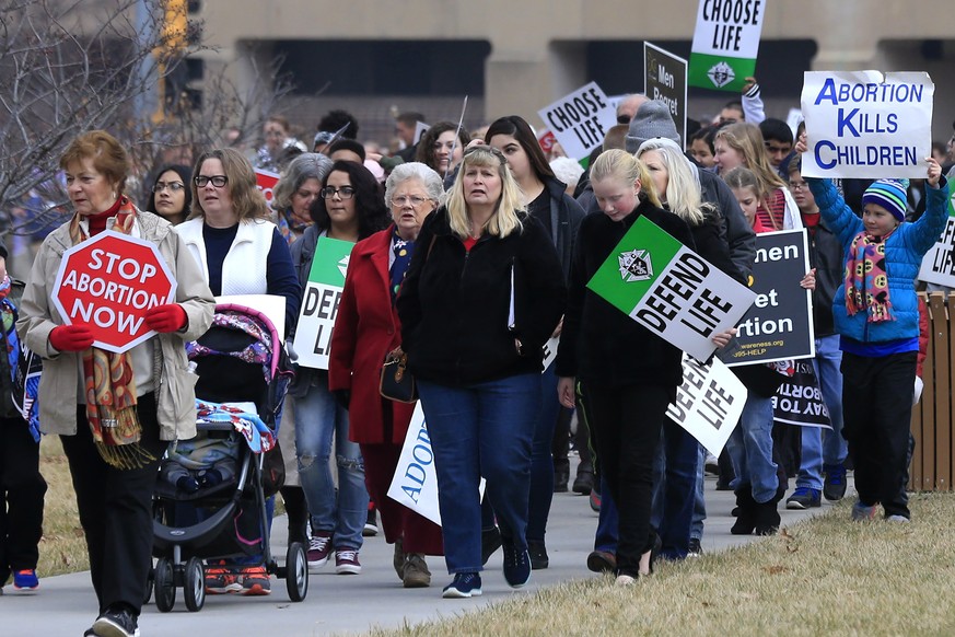 FILE - In this Jan. 23, 2017, file photo, marchers arrive for a Roe v. Wade protest as hundreds converge on the Kansas Statehouse in Topika, Kan. Top Kansas Republicans are pushing to overturn a state ...