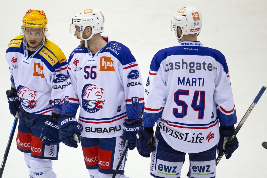 Lions&#039; forward Sven Andrighetto, left, talks with teammates defender Maxim Noreau #56, of Canada, and defender Christian Marti, right, during the second leg of the National League Swiss Champions ...