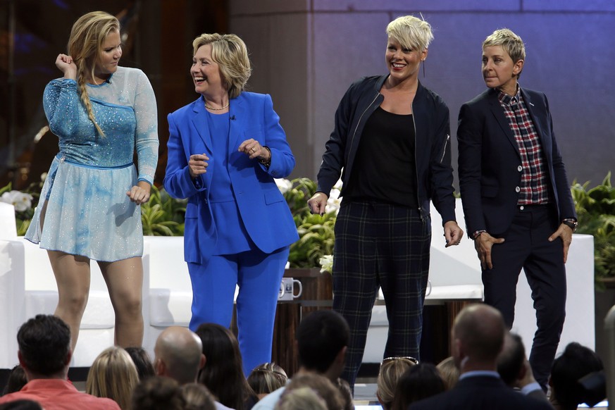 Actress Amy Schumer, left, Democratic presidential candidate Hillary Rodham Clinton, second from left, Ellen DeGeneres and musician Pink dance on stage during a taping of The Ellen DeGeneres Show, Tue ...
