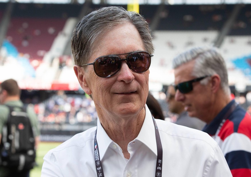 John Henry, owner of the Boston Globe, The Boston Red Sox and Liverpool football club waits for the Major League Baseball game pitting the New York Yankees against the Boston Red Sox at the London Sta ...