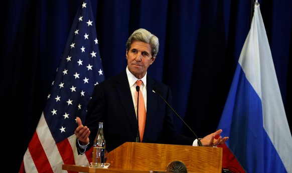 U.S. Secretary of State John Kerry gestures during a press conference with Russian Foreign Minister Sergei Lavrov following their meeting in Geneva, Switzerland about the crisis in Syria late Septembe ...