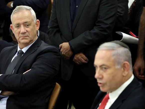 epa07972157 Leader of the blue and white political party and candidate for prime minister Benny Gantz (L) and Israeli prime minister Benjamin Netanyahu (R) attend a memorial service for Israel spiritu ...