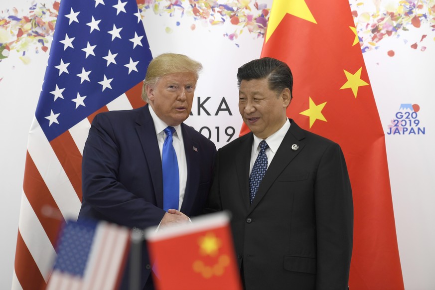 President Donald Trump poses for a photo with Chinese President Xi Jinping during a meeting on the sidelines of the G-20 summit in Osaka, Japan, Saturday, June 29, 2019. (AP Photo/Susan Walsh)
Donald  ...