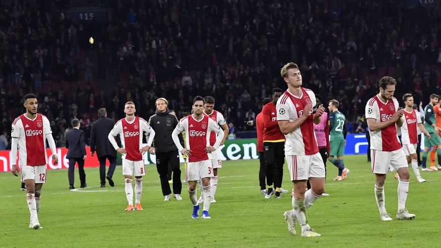 Ajax players walk on the pitch at the end of the Champions League semifinal second leg soccer match between Ajax and Tottenham Hotspur at the Johan Cruyff ArenA in Amsterdam, Netherlands, Wednesday, M ...