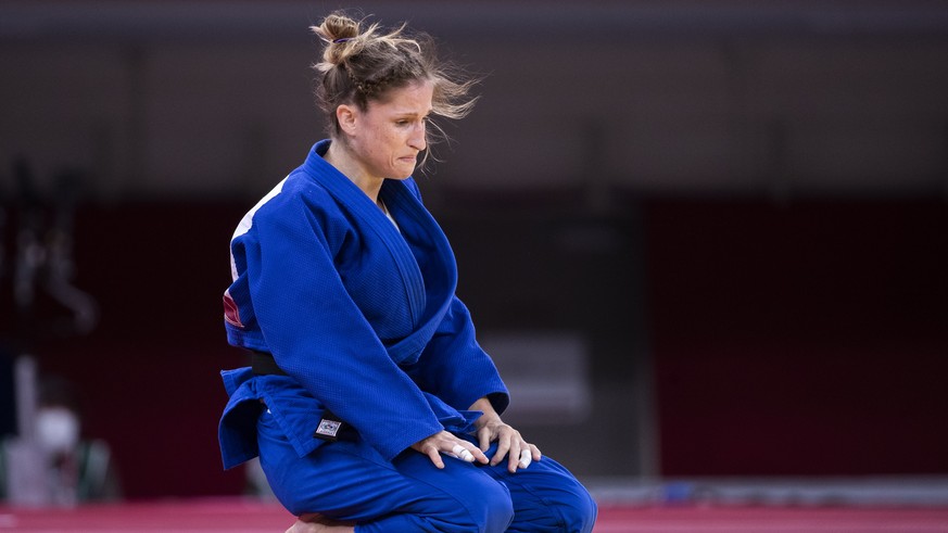 Fabienne Kocher of Switzerland is disappointed after her defeat in the bronze medal fight against Great Britain&#039;s Chelsie Giles during the women&#039;s judo -52kg competition at the 2020 Tokyo Su ...