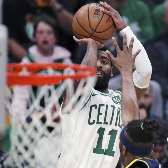 Boston Celtics guard Kyrie Irving (11) shoots over Indiana Pacers center Myles Turner (33) during the first quarter of Game 2 of an NBA basketball first-round playoff series, Wednesday, April 17, 2019 ...