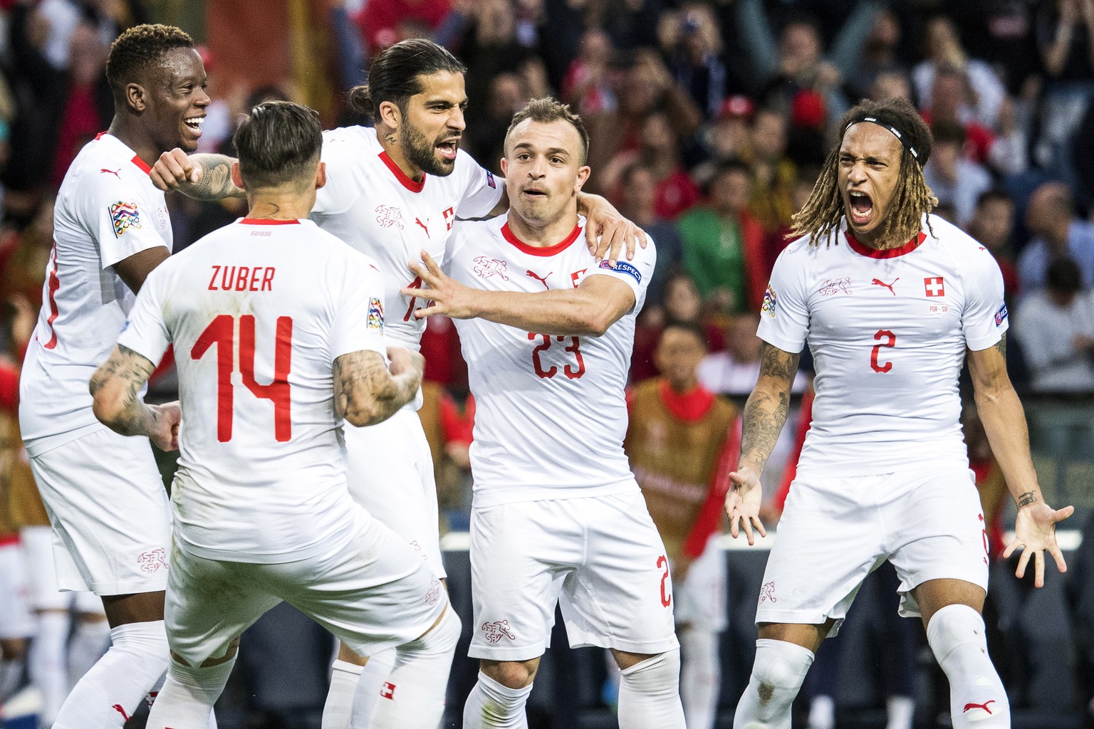 epa07628512 Switzerland&#039;s Ricardo Rodriguez (C) celebrates with his teammates after scoring the 1-1 equalizer from the penalty spot during the UEFA Nations League semi final soccer match between  ...