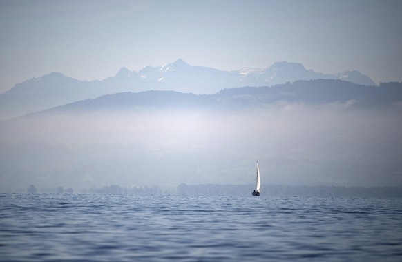 A boat sails in front of the Alps over the Lake Constance (Bodensee), southern Germany, Friday, Sept. 13, 2019. (Marijan Murat/dpa via AP)