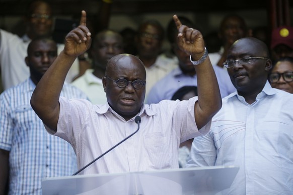 Nana Akufo-Addo opposition presidential candidate for the New Patriotic Party, gestures to his supporters during a press conference on election in his compound in Accra Ghana, Thursday, Dec. 8, 2016.  ...