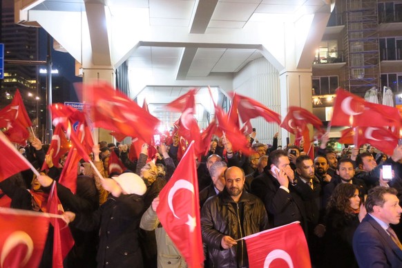 Crowd gather to welcome the Turkish Family Minister Fatma Betul Sayan Kaya, who decided to travel to Rotterdam by land after Turkish Foreign Minister Mevlut Cavusoglu&#039;s flight was barred from lan ...