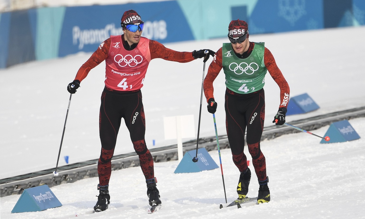 epa06538655 Dario Cologna (R) and Jonas Baumann of Switzerland in action during the Men&#039;s Cross Country 4 x 10 km Relay race at the Alpensia Cross Country Centre during the PyeongChang 2018 Olymp ...