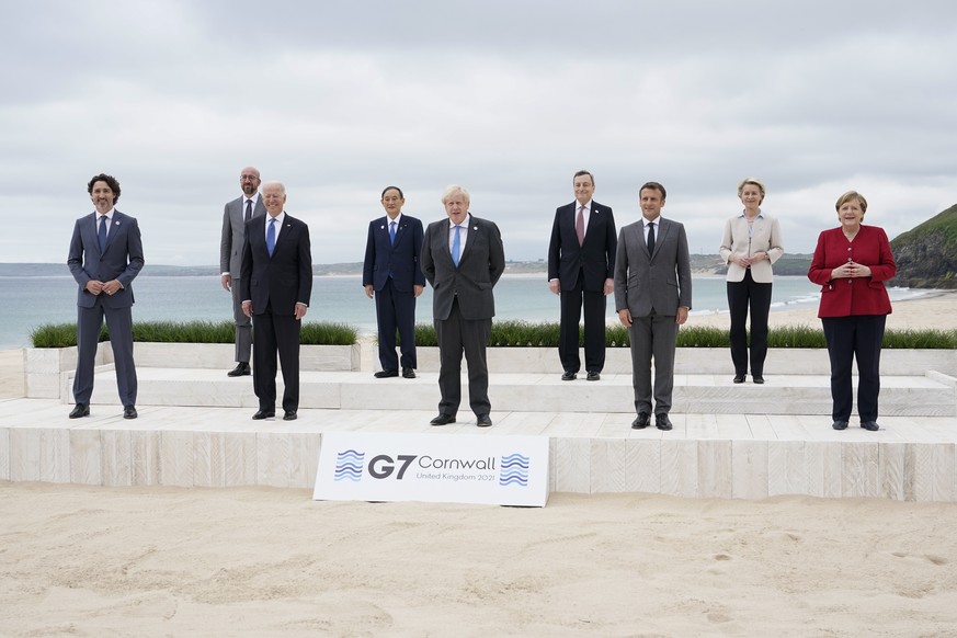 Leaders of the G7 pose for a group photo on overlooking the beach at the Carbis Bay Hotel in Carbis Bay, St. Ives, Cornwall, England, Friday, June 11, 2021. Leaders from left, Canadian Prime Minister  ...