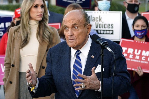 Rudy Giuliani, a lawyer for President Donald Trump, speaks during a news conference on legal challenges to vote counting in Pennsylvania, Wednesday, Nov. 4, 2020, in Philadelphia. At left is Lara Trum ...