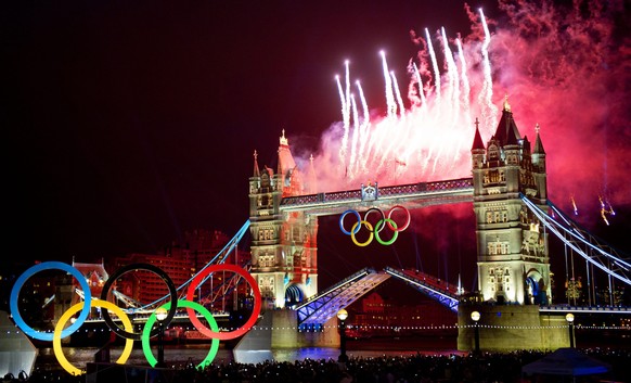 epa05332143 (FILE) Photo dated 27 July 2012 shows fireworks illuminating the sky over the Tower Bridge in London during the Opening Ceremony of the London 2012 Olympic Games, London, Britain. The IOC  ...