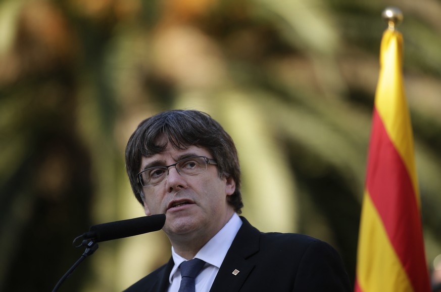 Catalan regional President Carles Puigdemont addresses to the media after a ceremony commemorating the 77th anniversary of the death of Catalan leader Lluis Companys at the Montjuic Cemetery in Barcel ...