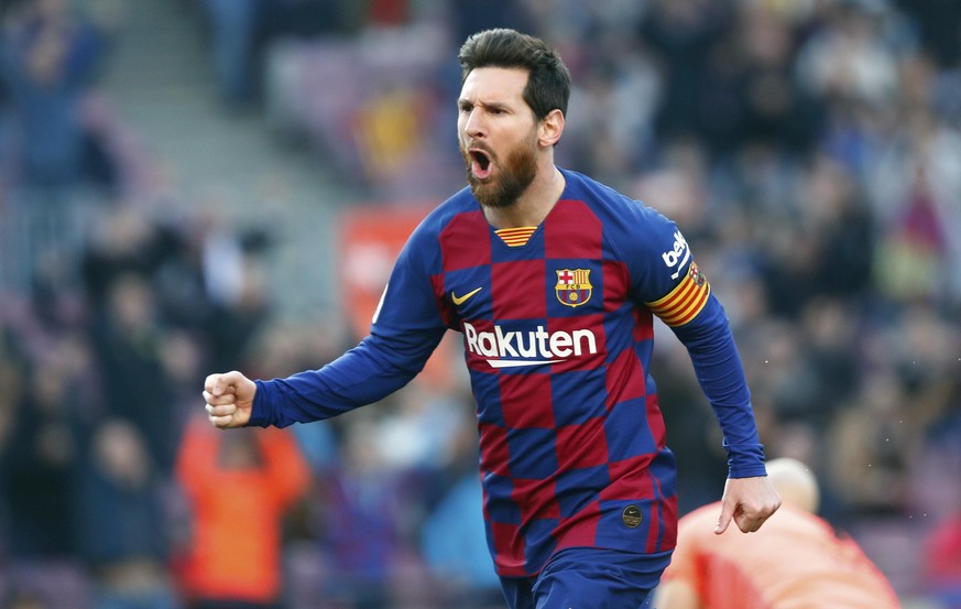 FILE - In this Saturday, Feb. 22, 2020 file photo, Barcelona&#039;s Lionel Messi celebrates after scoring his side&#039;s opening goal during a Spanish La Liga soccer match between Barcelona and Eibar ...