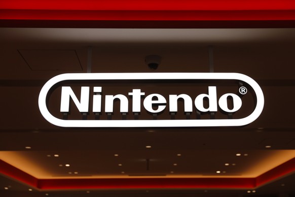 FILE - In this Jan. 23, 2020, file photo, a Nintendo sign is seen at the company&#039;s official store in the Shibuya district of Tokyo. Nintendo Co.���s profit for the fiscal year ended in March jump ...